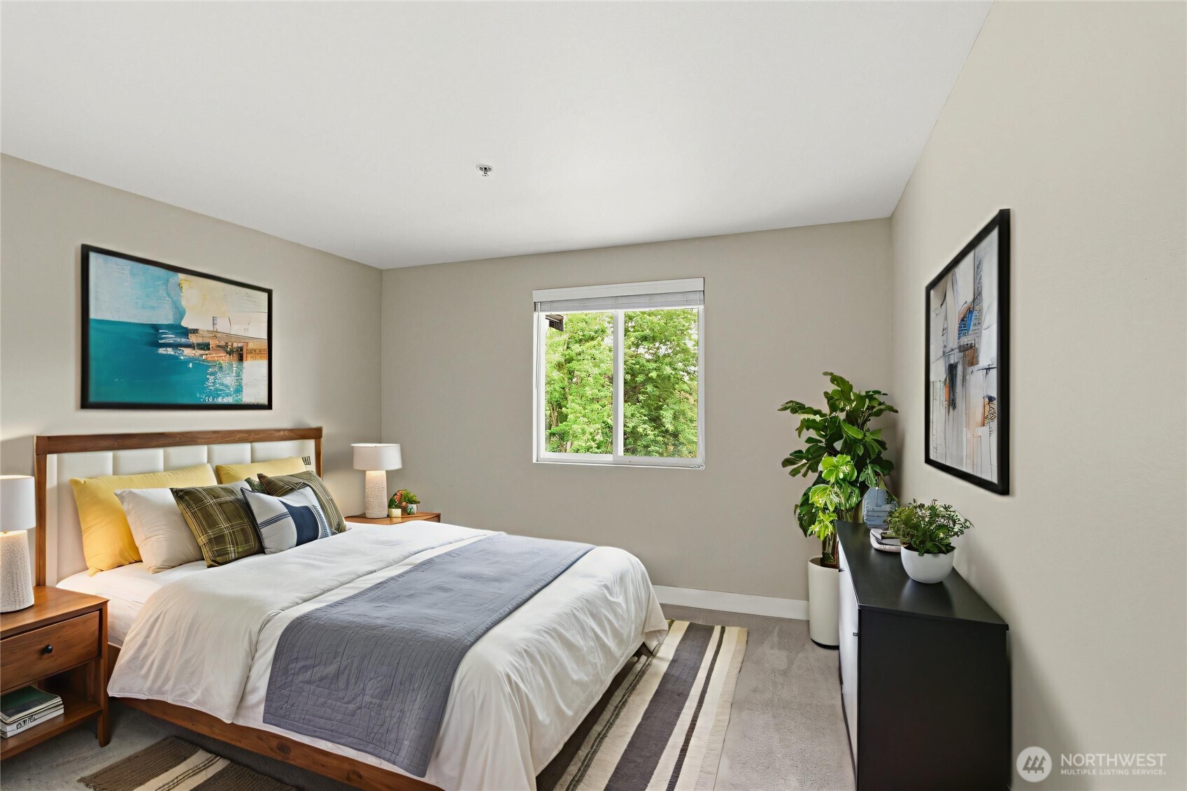 16409 Currie Road Southeast, Unit A308 Monroe, WA 98272 - Photo 10 of 21 a bedroom with a bed and a potted plant
