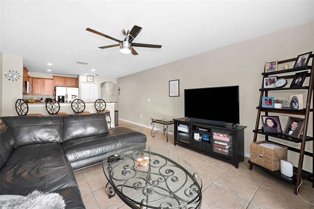 9736 Trumpet Vine Loop Trinity, FL 34655 - Photo 2 of 35 a living room with furniture and a flat screen tv