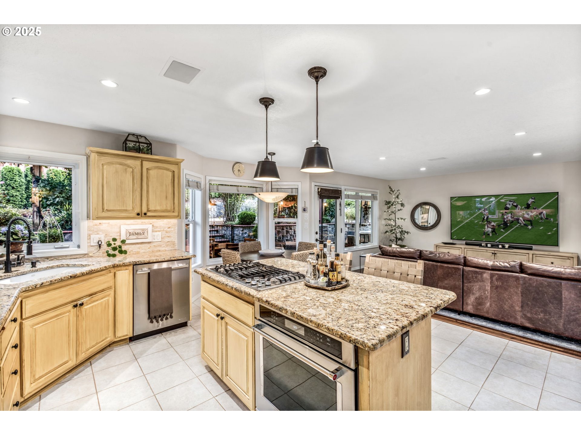 12176 Southwest Ames Lane Portland, OR 97224 - Photo 15 of 46 a kitchen with a stove and a view of living room