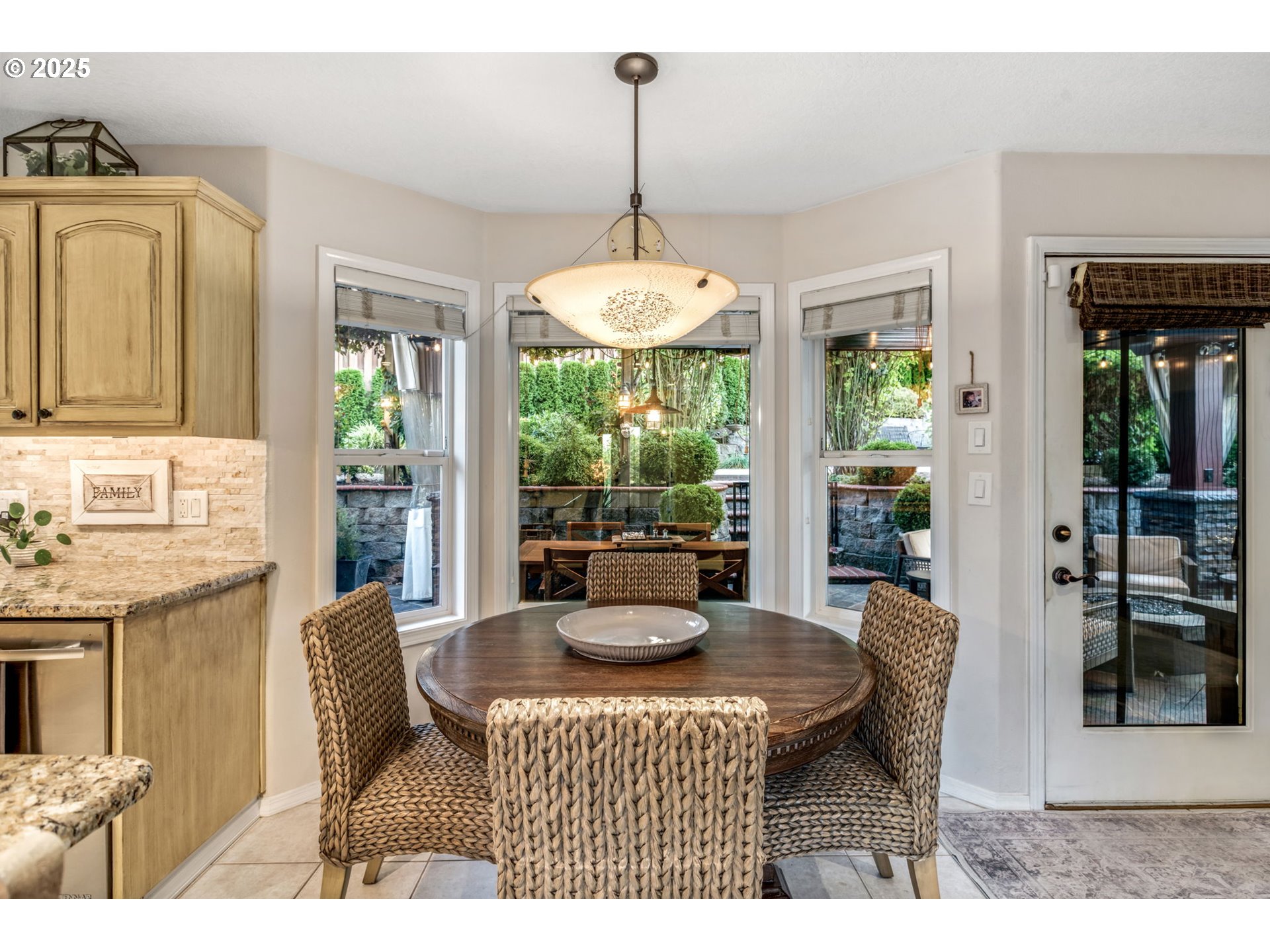 12176 Southwest Ames Lane Portland, OR 97224 - Photo 16 of 46 a dining room with furniture and large windows