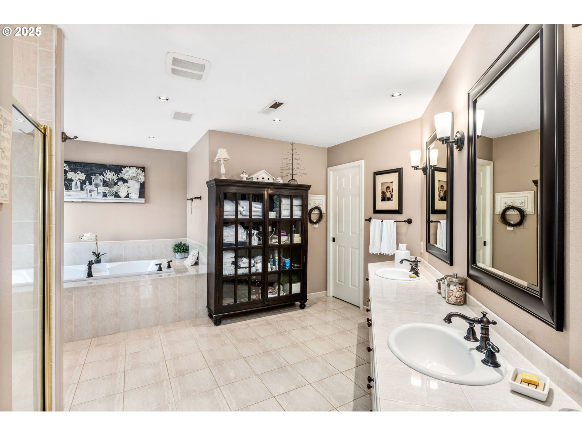 12176 Southwest Ames Lane Portland, OR 97224 - Photo 22 of 46 a bathroom with a sink double vanity and shower