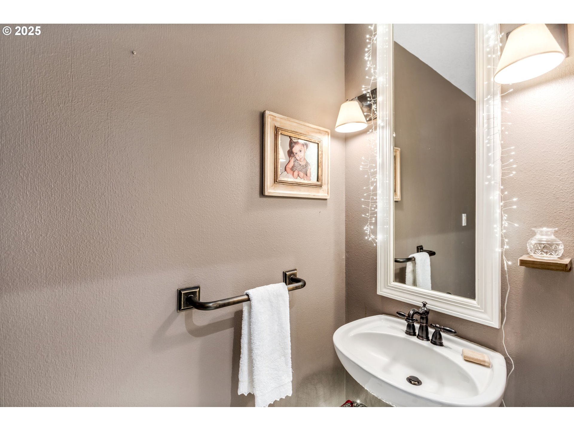 12176 Southwest Ames Lane Portland, OR 97224 - Photo 30 of 46 a bathroom with a sink and a mirror
