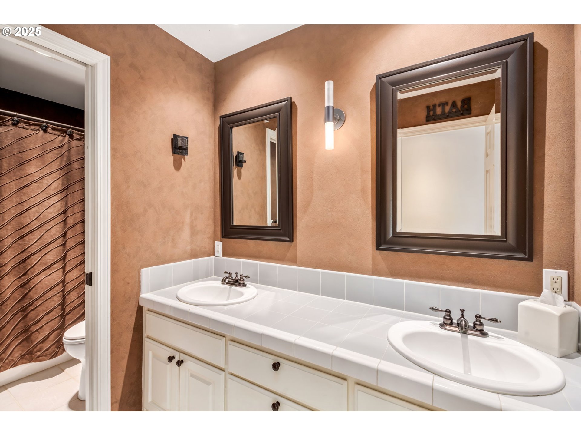 12176 Southwest Ames Lane Portland, OR 97224 - Photo 33 of 46 a bathroom with a sink vanity and mirror