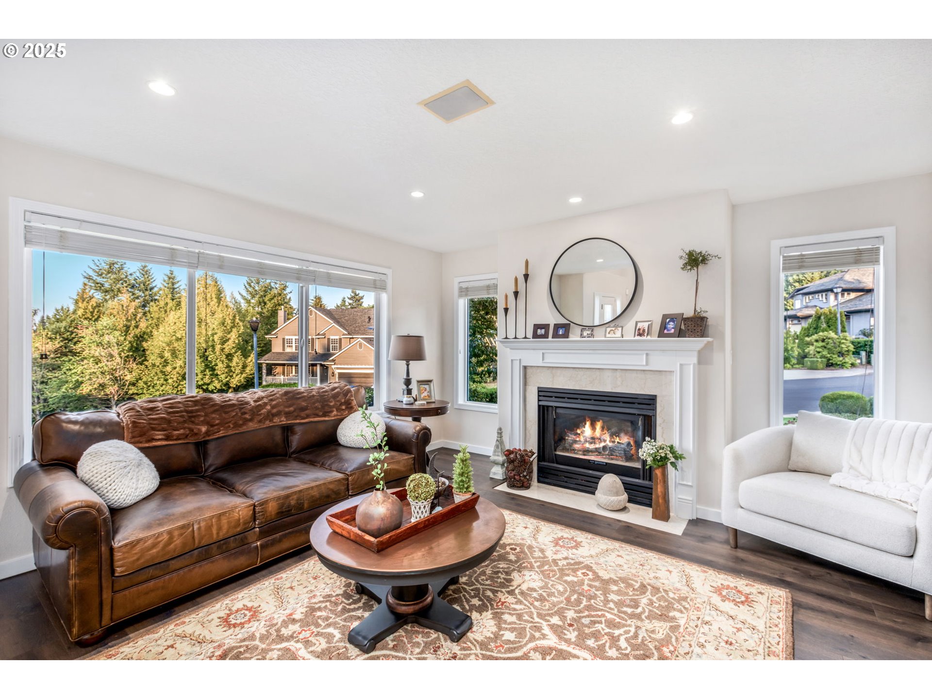 12176 Southwest Ames Lane Portland, OR 97224 - Photo 5 of 46 a living room with furniture and a fireplace