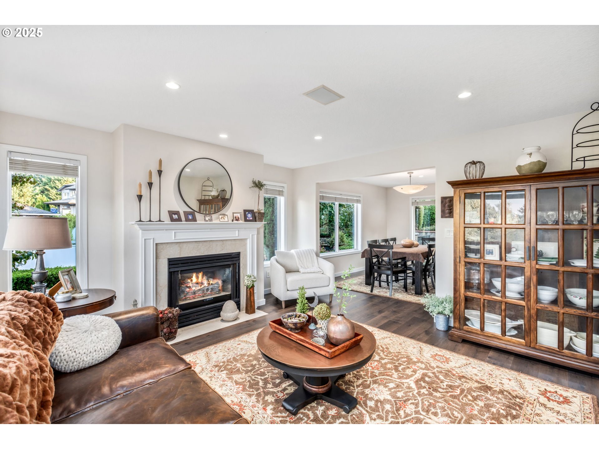 12176 Southwest Ames Lane Portland, OR 97224 - Photo 6 of 46 a living room with furniture and a fireplace