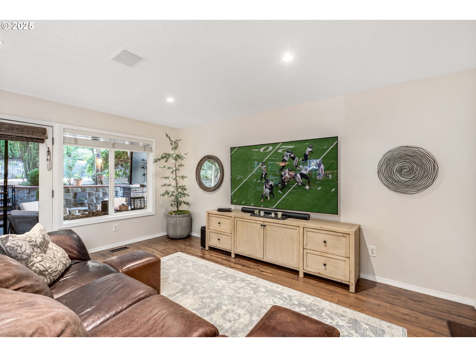 12176 Southwest Ames Lane Portland, OR 97224 - Photo 7 of 46 a living room with furniture and a flat screen tv