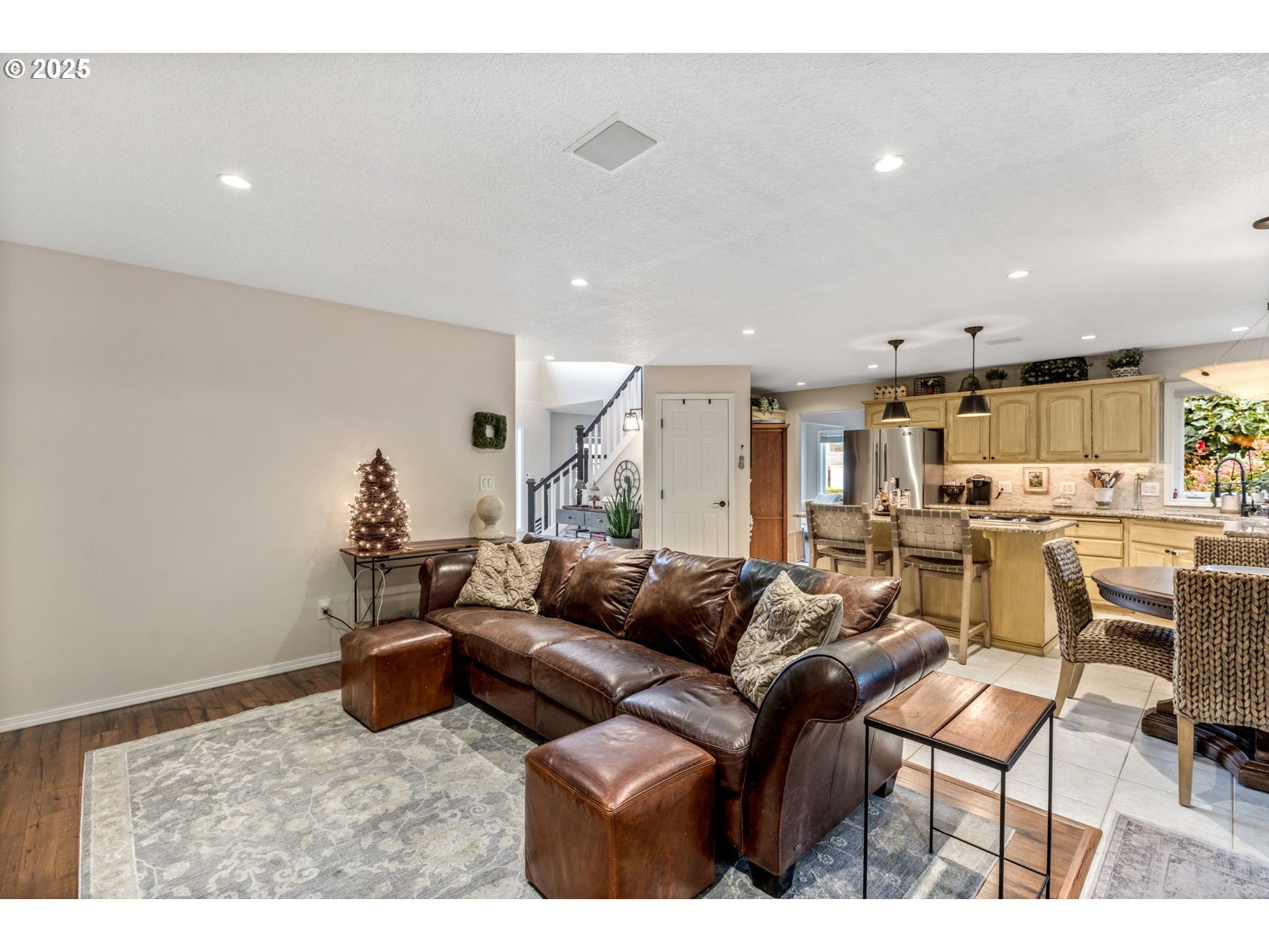 12176 Southwest Ames Lane Portland, OR 97224 - Photo 10 of 46 a living room with furniture and a view of kitchen