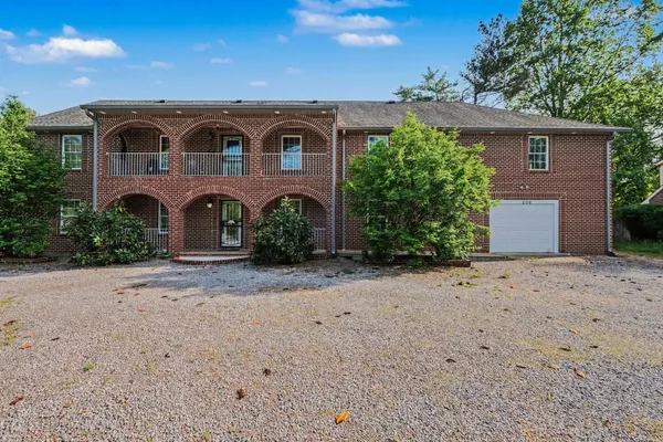 a view of a front of house with a yard