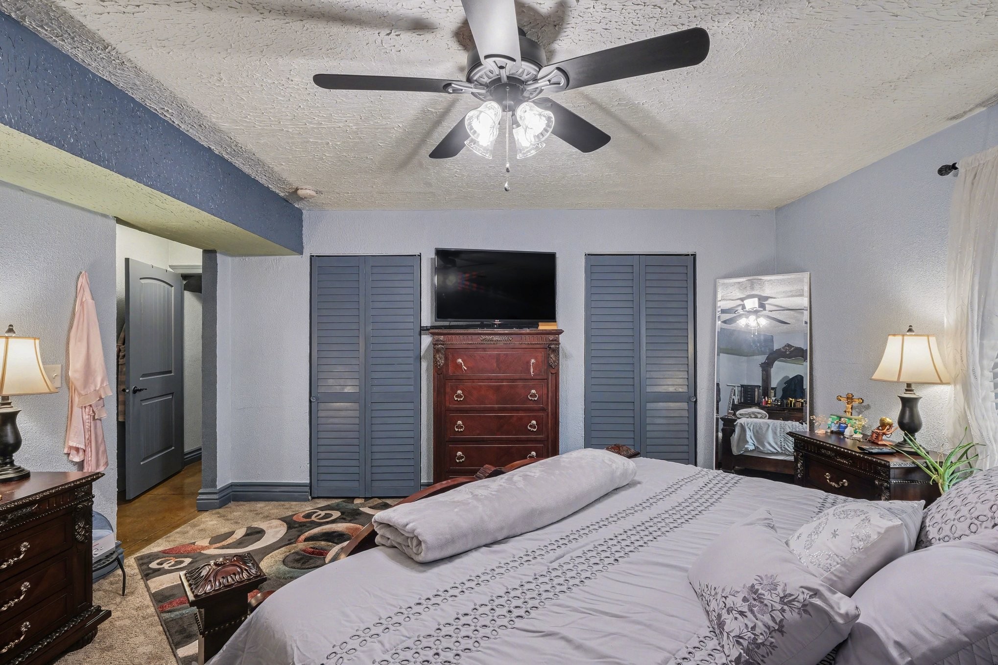 206 McKaig Road Murfreesboro, TN 37127 - Photo 13 of 36 a bedroom with a bed and a flat tv screen on dresser