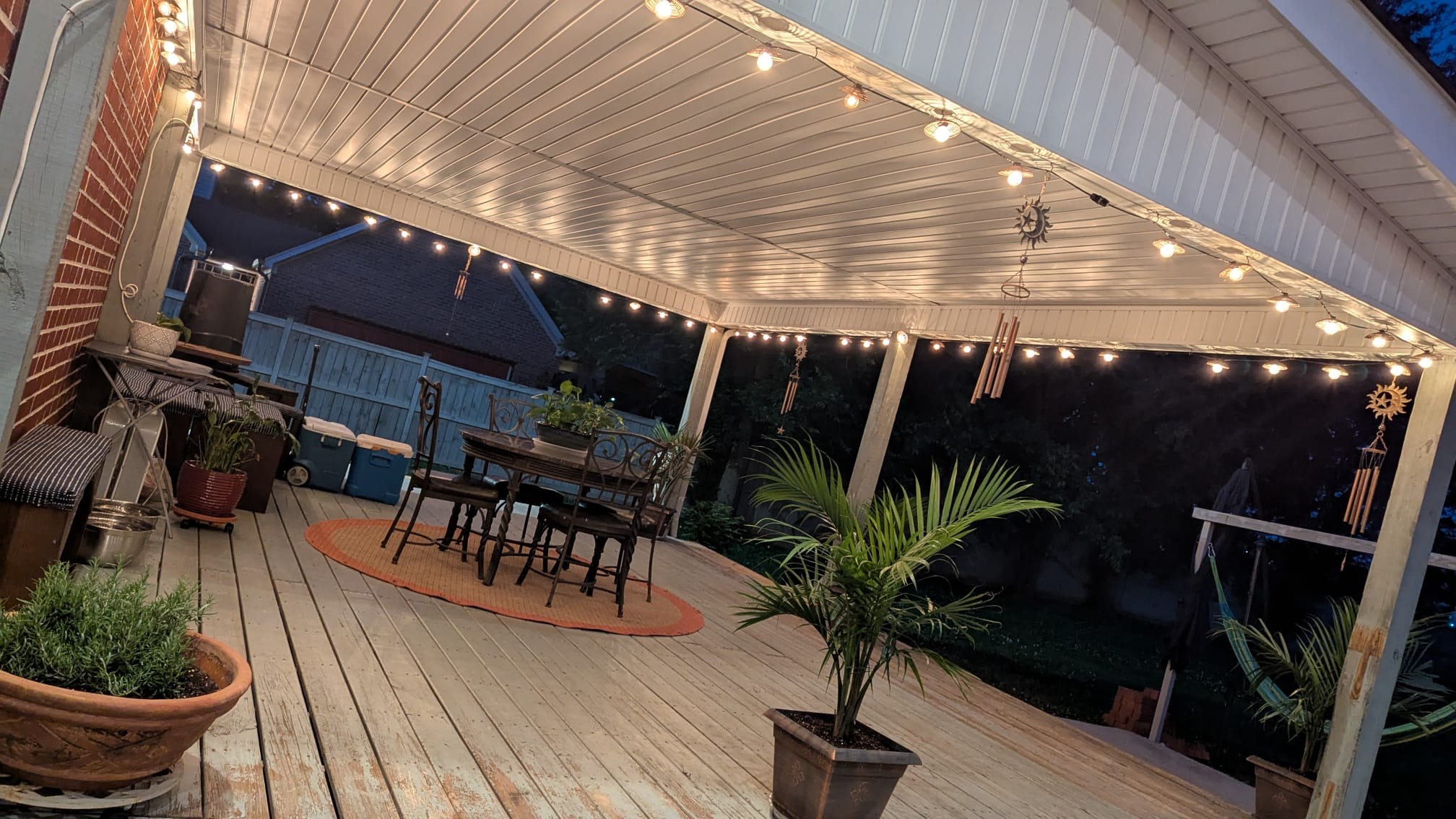 206 McKaig Road Murfreesboro, TN 37127 - Photo 35 of 36 a view of a backyard with table and chairs potted plants and wooden floor