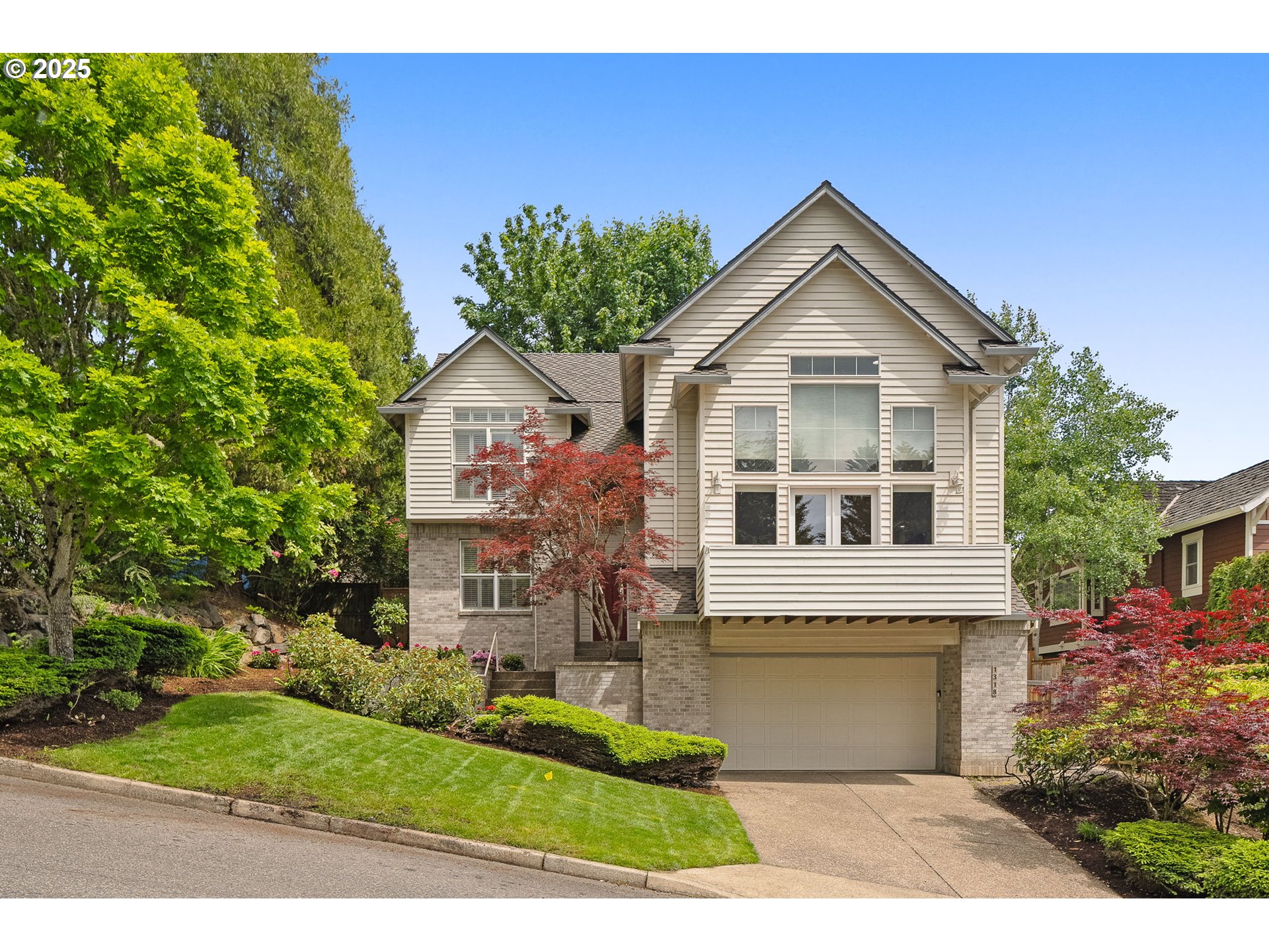 1318 Northwest Slocum Way Portland, OR 97229 - Photo 1 of 33 a front view of a house with a garden