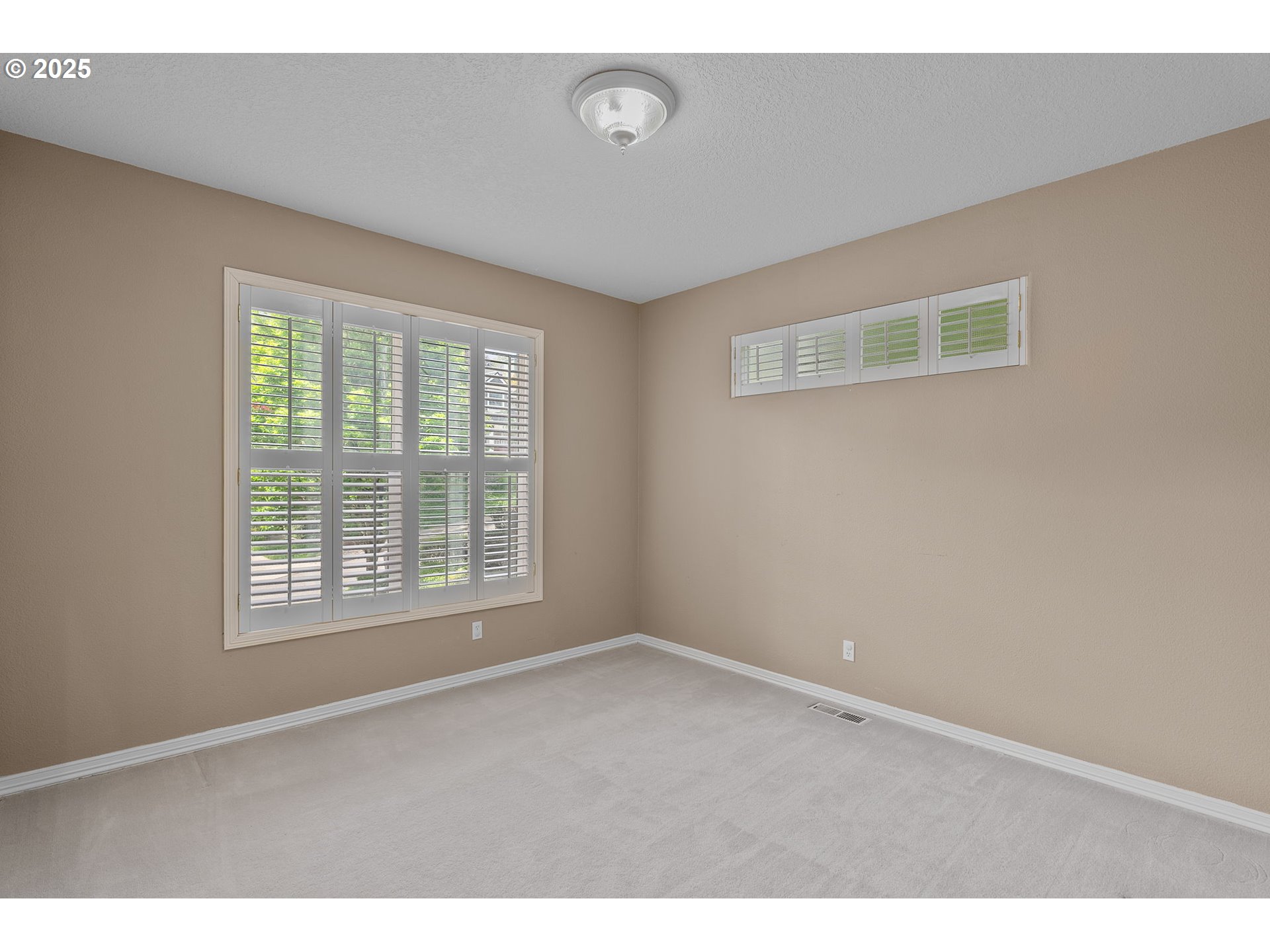 1318 Northwest Slocum Way Portland, OR 97229 - Photo 15 of 33 a view of an empty room with a window