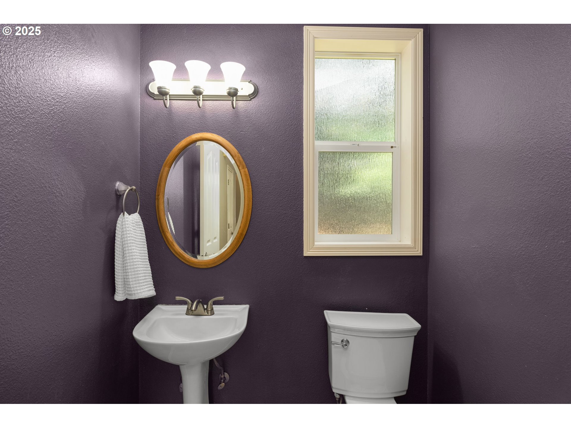 1318 Northwest Slocum Way Portland, OR 97229 - Photo 17 of 33 a bathroom with a sink and a mirror