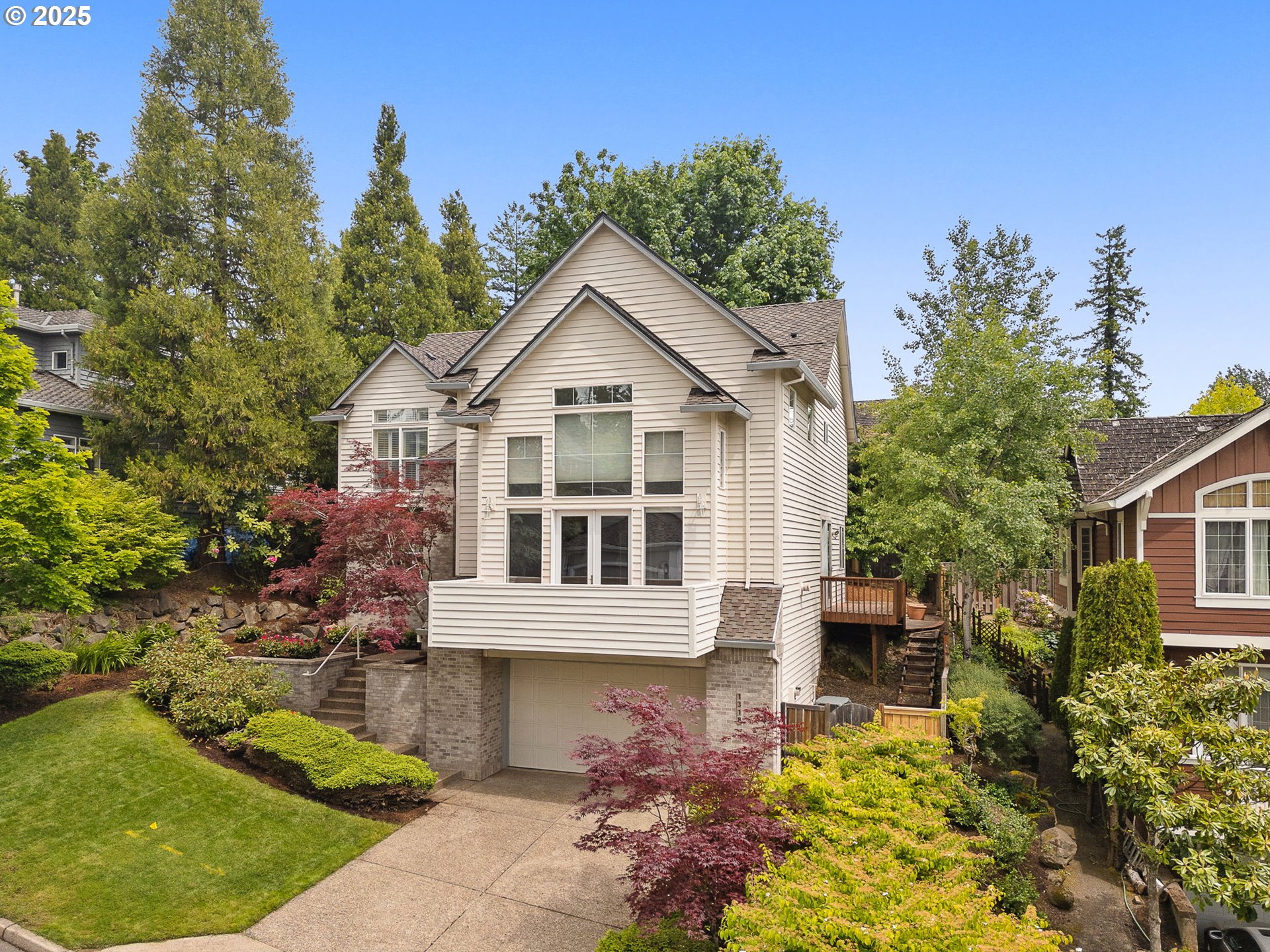 1318 Northwest Slocum Way Portland, OR 97229 - Photo 2 of 33 a view of a yard with plants and trees