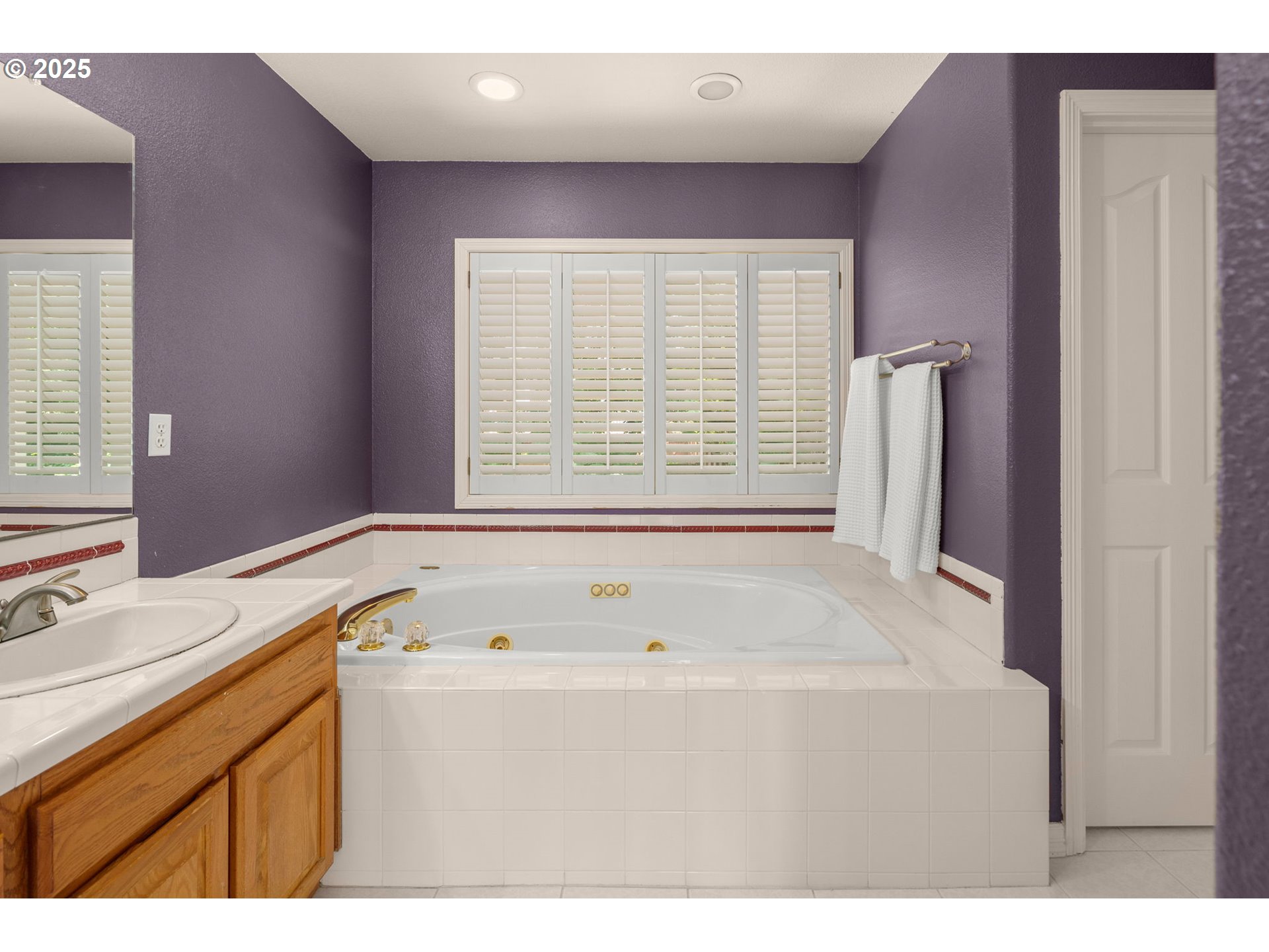 1318 Northwest Slocum Way Portland, OR 97229 - Photo 21 of 33 a bathroom with a tub sink and mirror