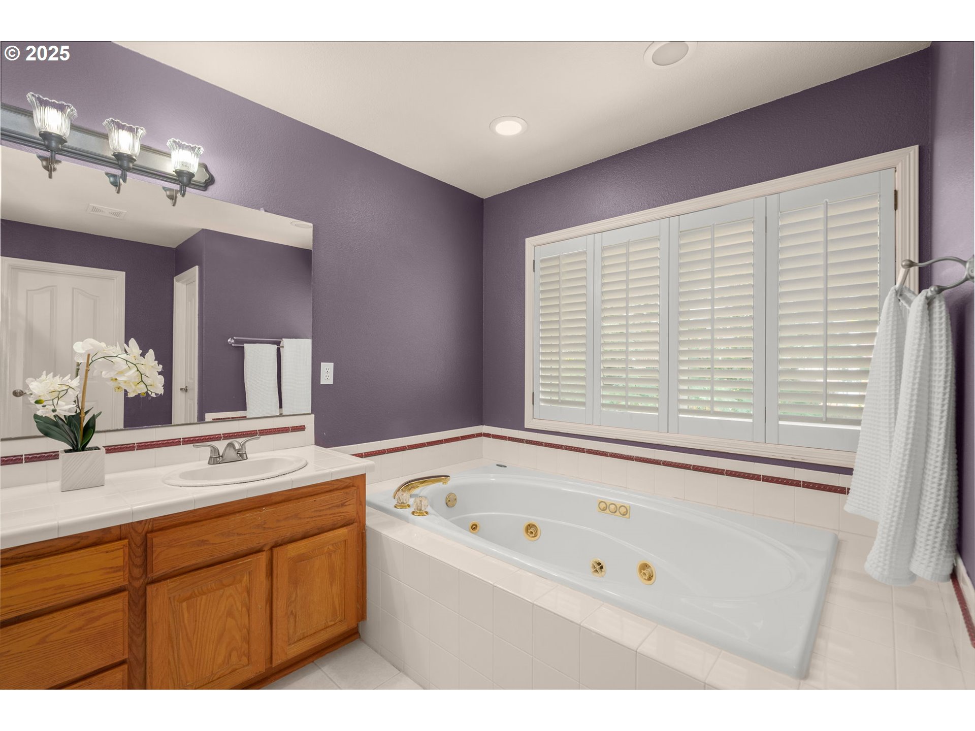 1318 Northwest Slocum Way Portland, OR 97229 - Photo 22 of 33 a bathroom with a tub sink and mirror