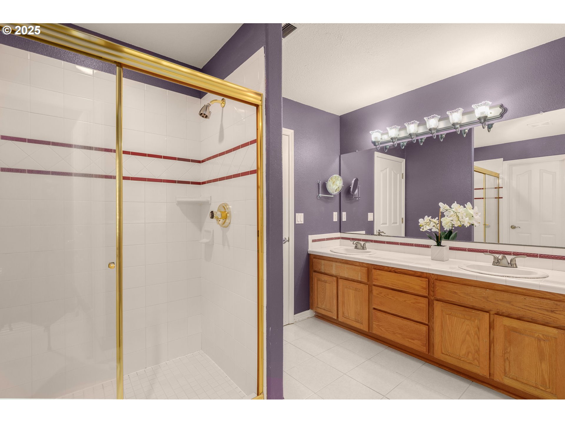 1318 Northwest Slocum Way Portland, OR 97229 - Photo 23 of 33 a bathroom with a double vanity sink and mirror