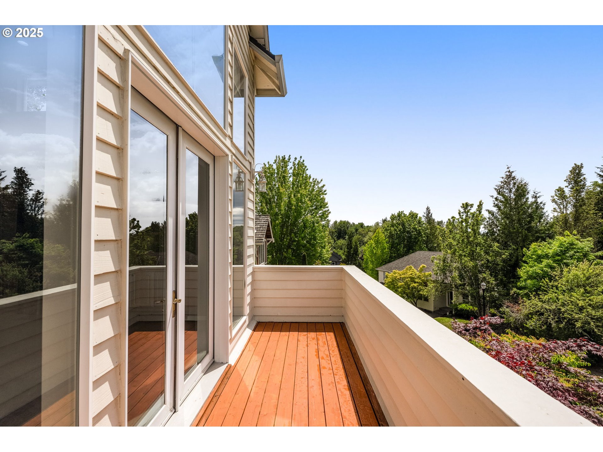 1318 Northwest Slocum Way Portland, OR 97229 - Photo 10 of 33 a view of balcony with floor to ceiling windows and wooden fence