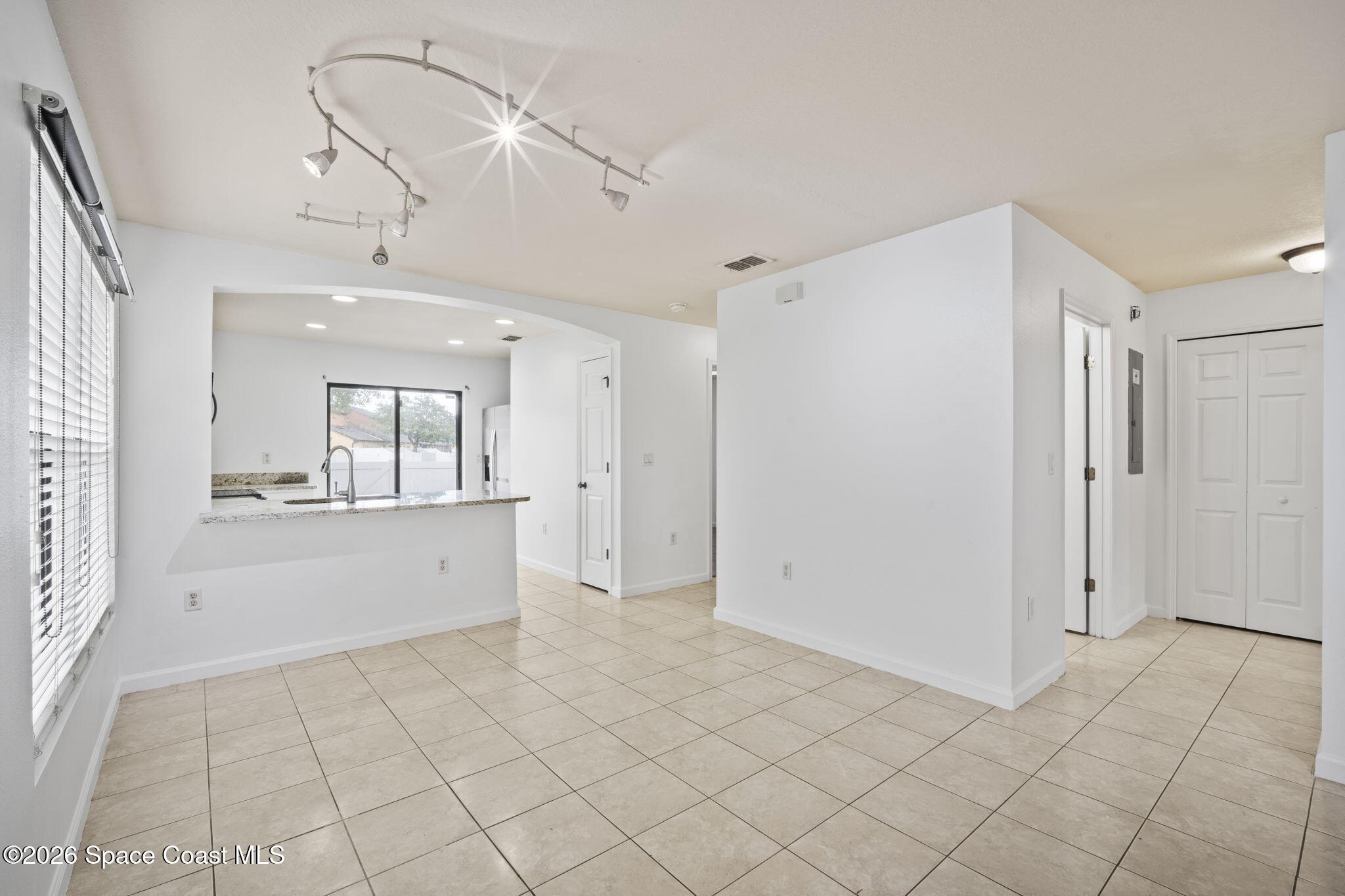 4555 Radiant Way, Unit 103 Melbourne, FL 32901 - Photo 14 of 58 a view of an empty room and window