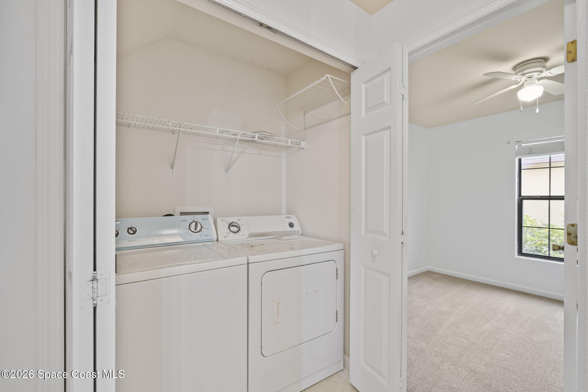 4555 Radiant Way, Unit 103 Melbourne, FL 32901 - Photo 15 of 58 a view of utility room with washer and dryer