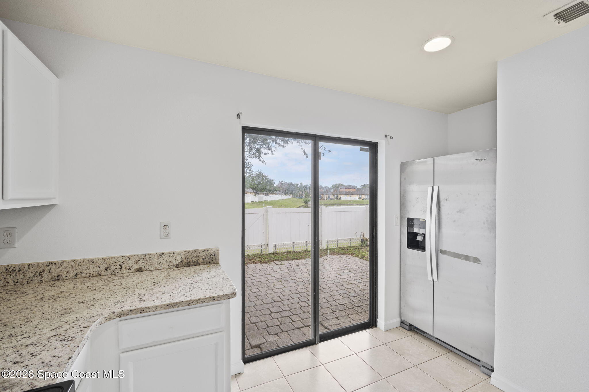 4555 Radiant Way, Unit 103 Melbourne, FL 32901 - Photo 19 of 58 a bathroom with a granite countertop sink and a mirror