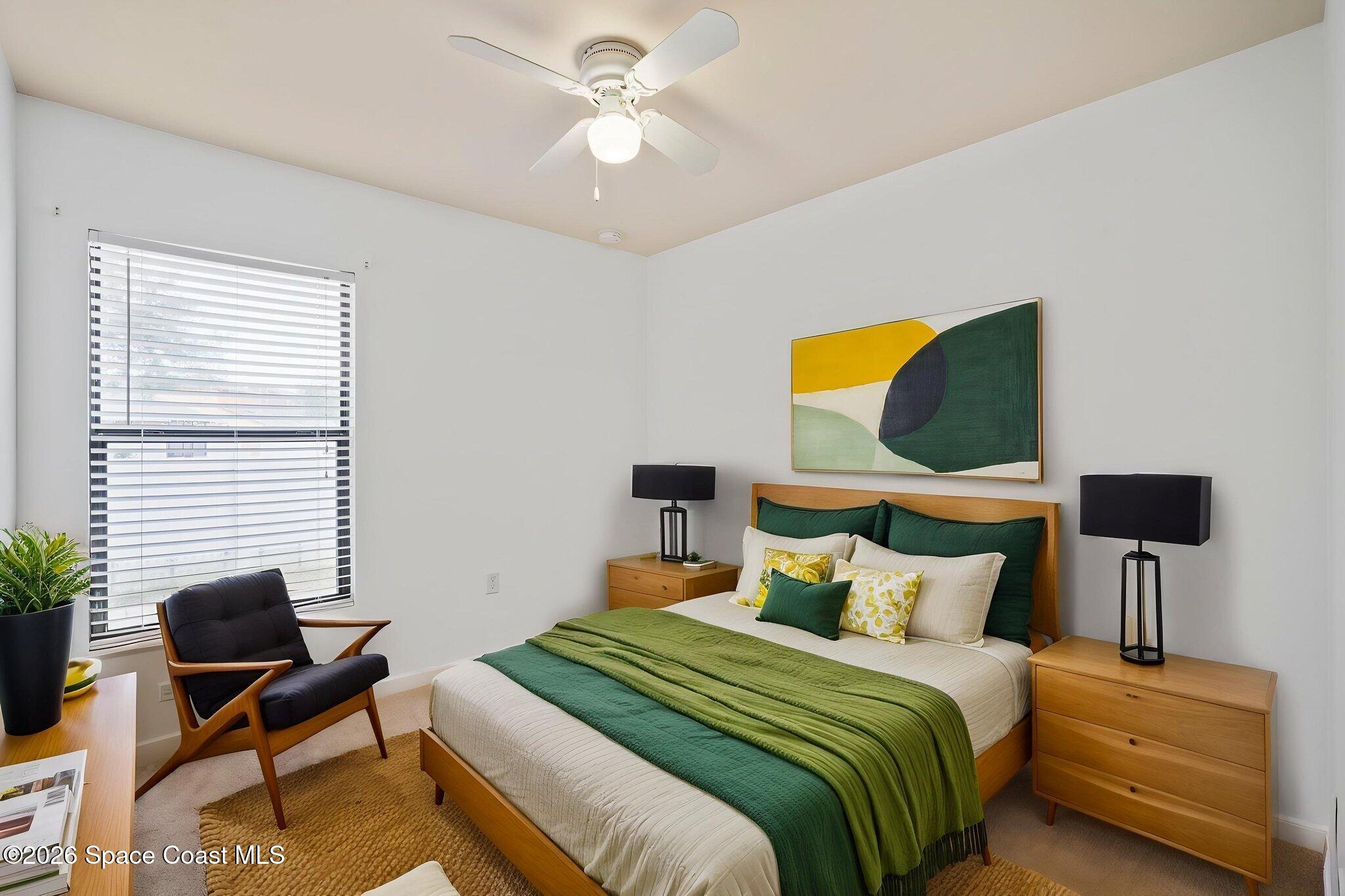 4555 Radiant Way, Unit 103 Melbourne, FL 32901 - Photo 21 of 58 a bedroom with a bed and a window