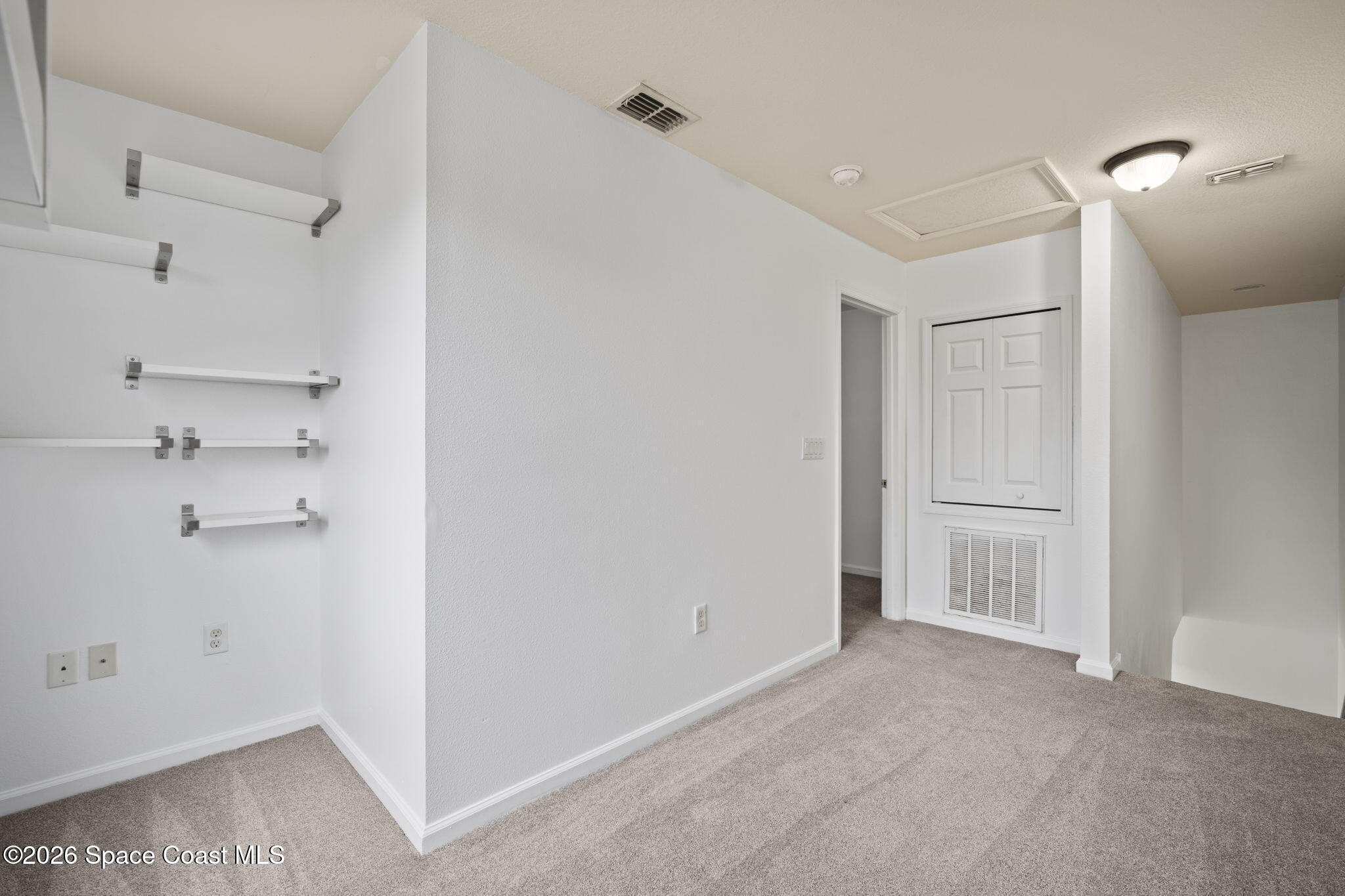 4555 Radiant Way, Unit 103 Melbourne, FL 32901 - Photo 30 of 58 a view of an empty room