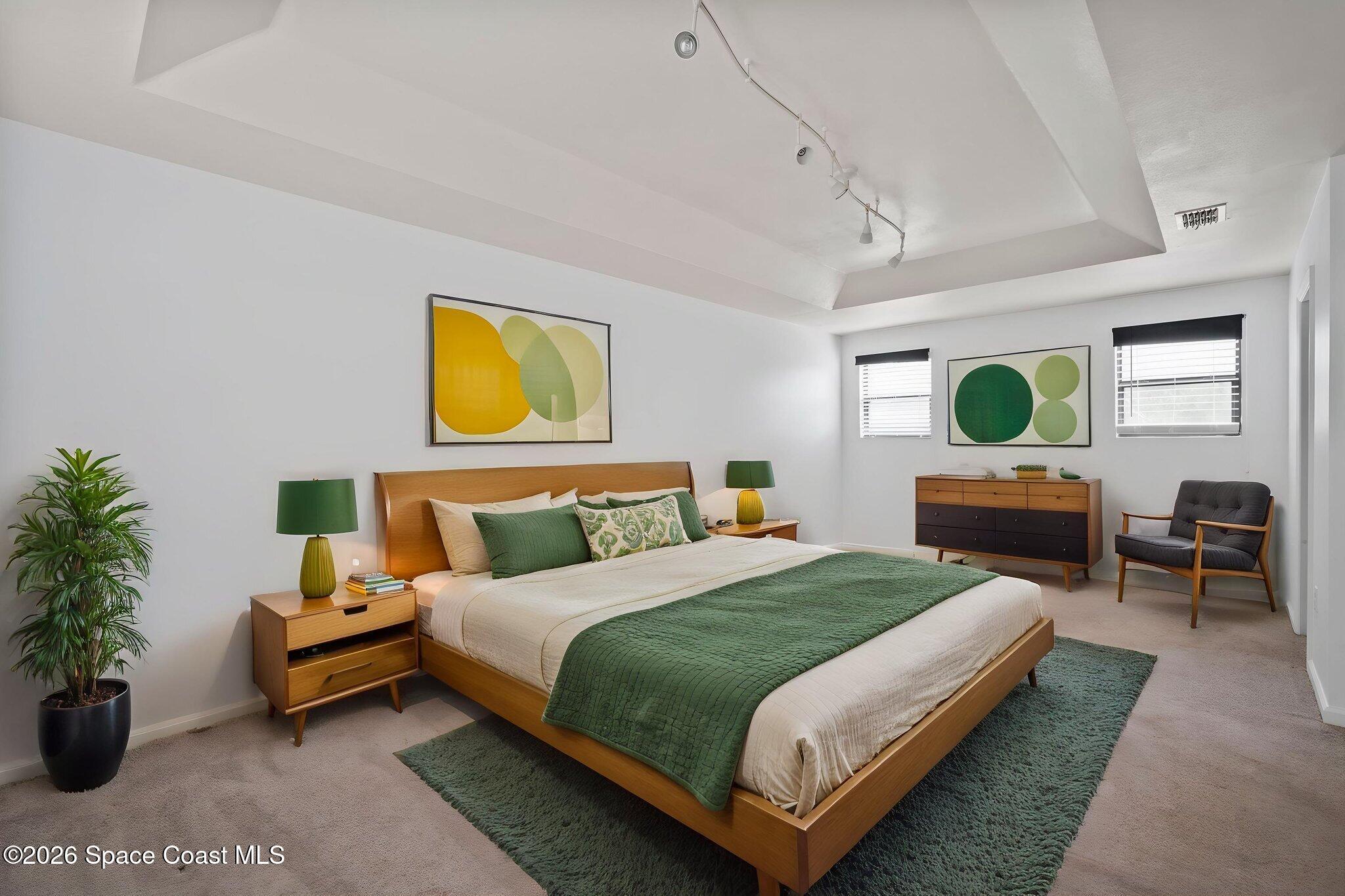 4555 Radiant Way, Unit 103 Melbourne, FL 32901 - Photo 34 of 58 a bedroom with a bed and a potted plant