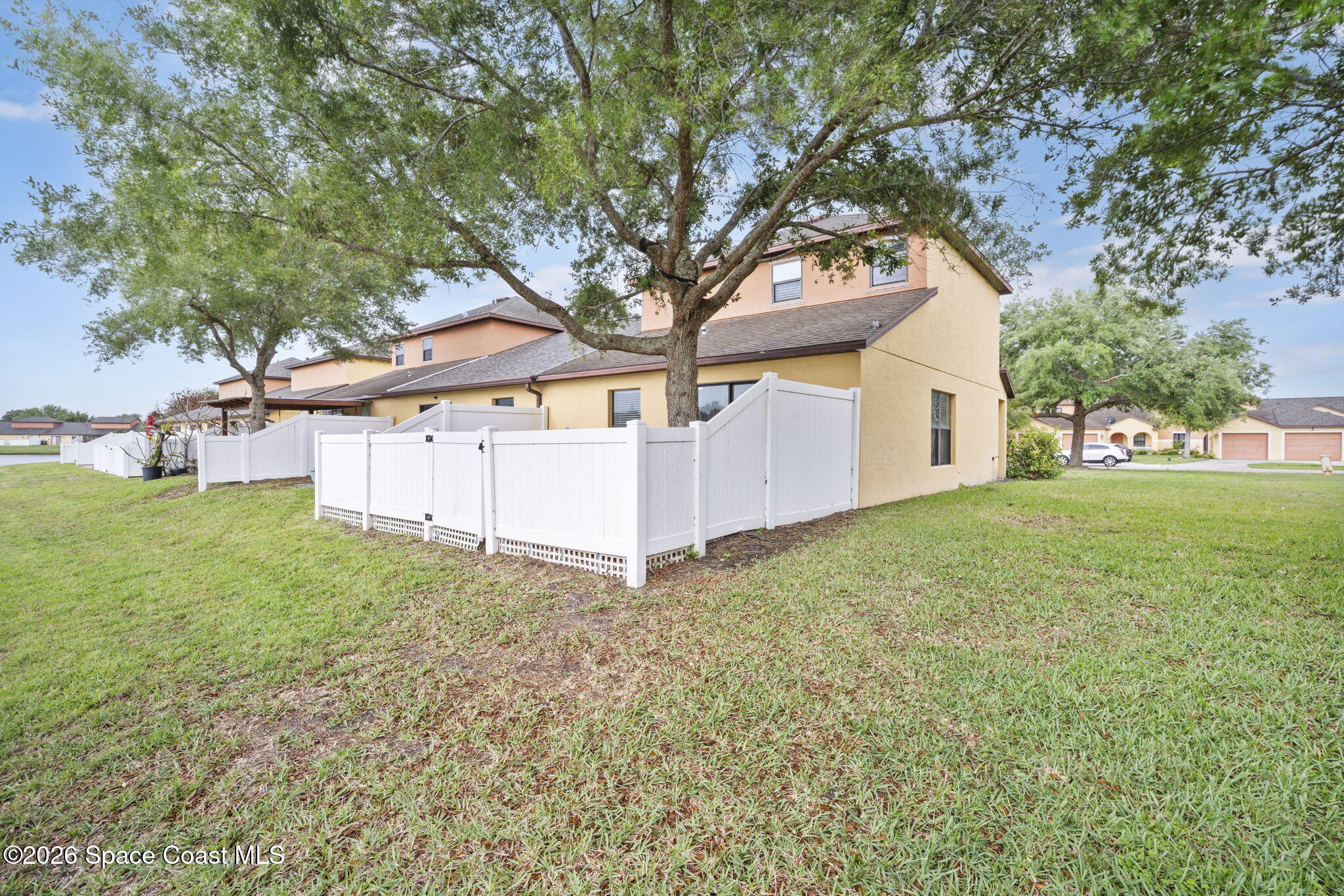 4555 Radiant Way, Unit 103 Melbourne, FL 32901 - Photo 41 of 58 front view of a house with a yard