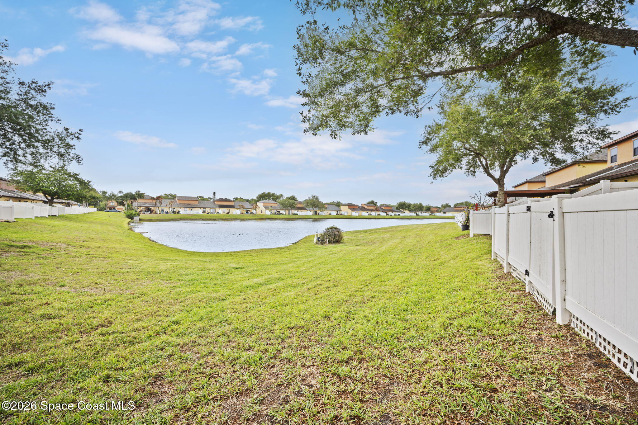 4555 Radiant Way, Unit 103 Melbourne, FL 32901 - Photo 42 of 58 a view of an swimming pool and an outdoor seating