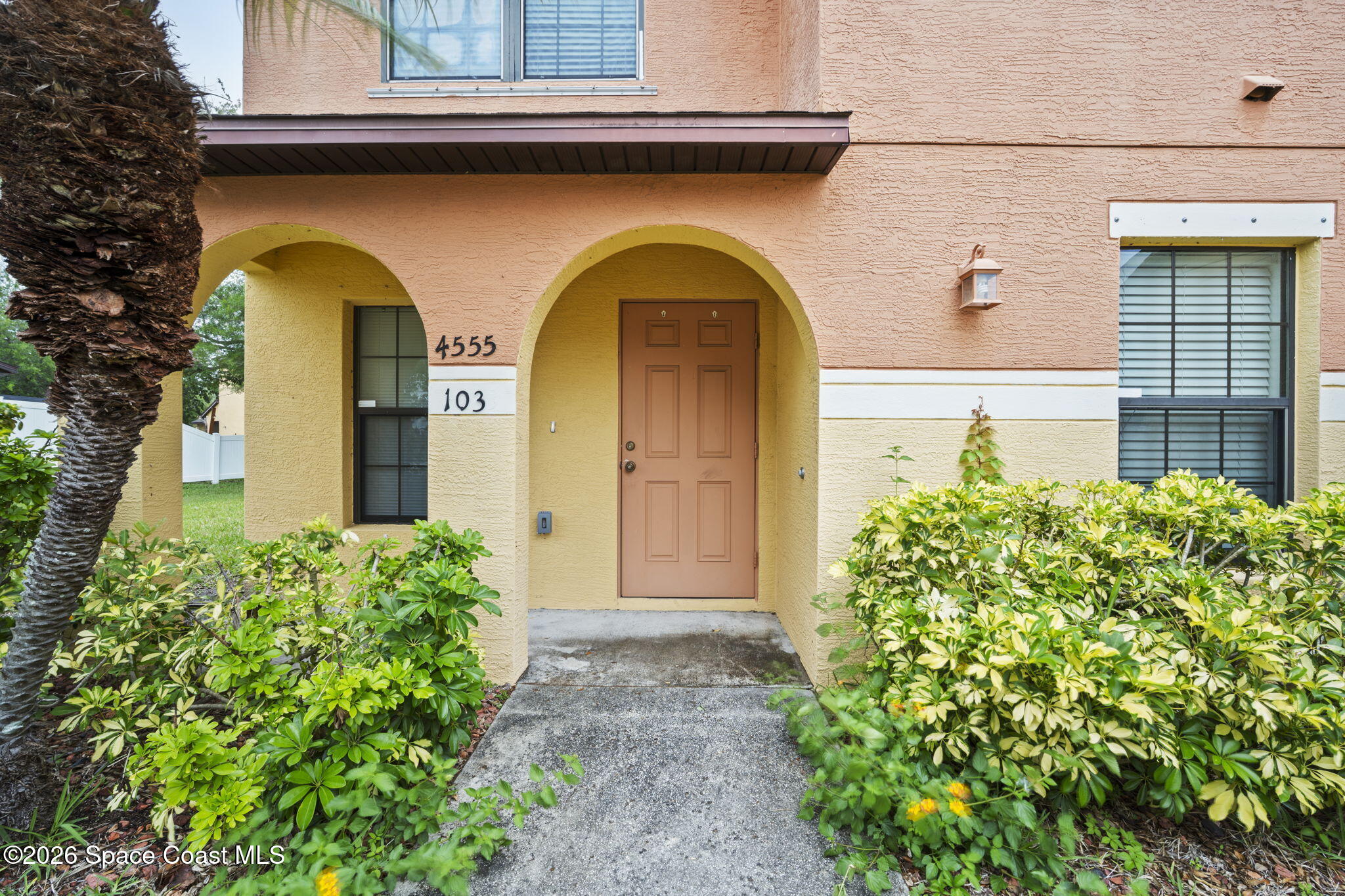 4555 Radiant Way, Unit 103 Melbourne, FL 32901 - Photo 7 of 58 a front view of a house