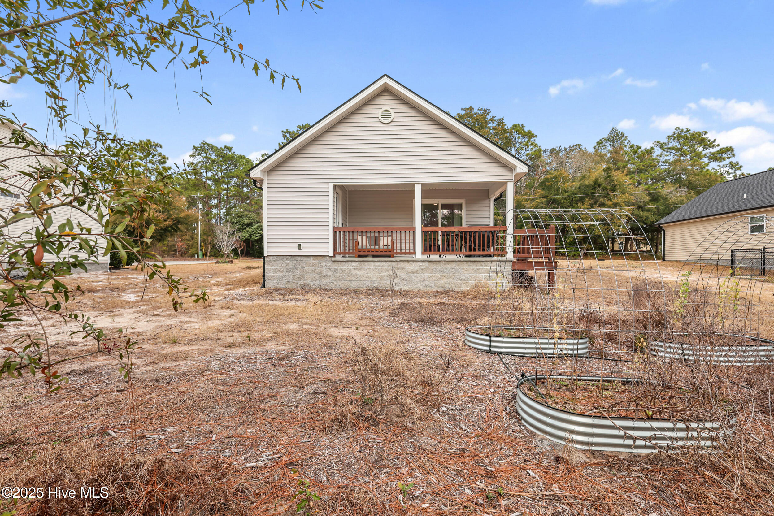 60 Greensboro Road Southport, NC 28461 - Photo 28 of 42 Rear of home-Raised Garden Beds