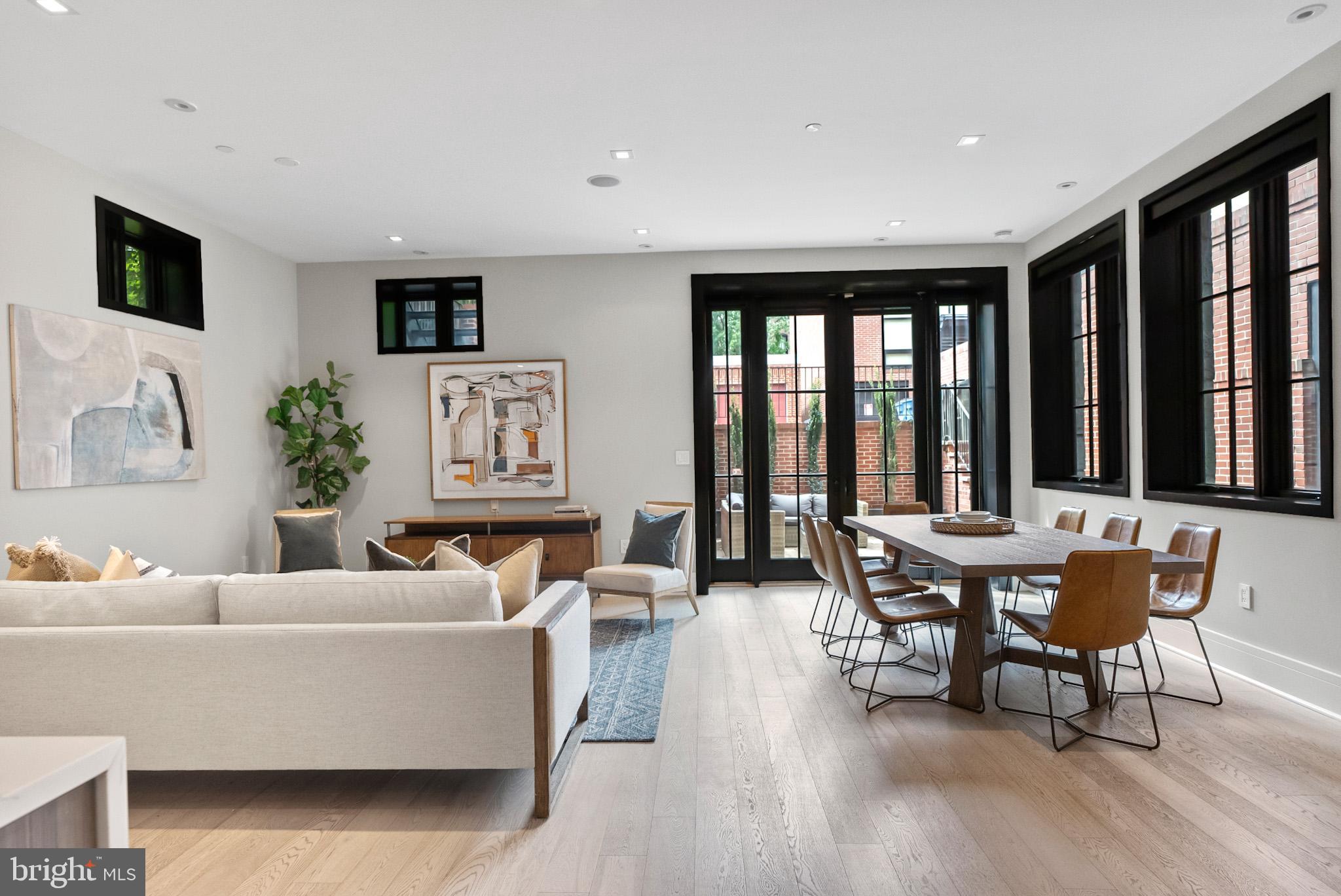 1310 Q Street Northwest, Unit 4 Washington, DC 20009 - Photo 1 of 1 a living room with furniture and large windows