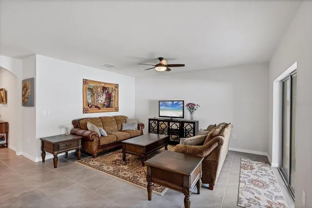 a living room with furniture and a rug