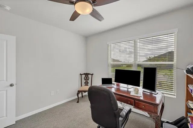 a workspace with furniture and window