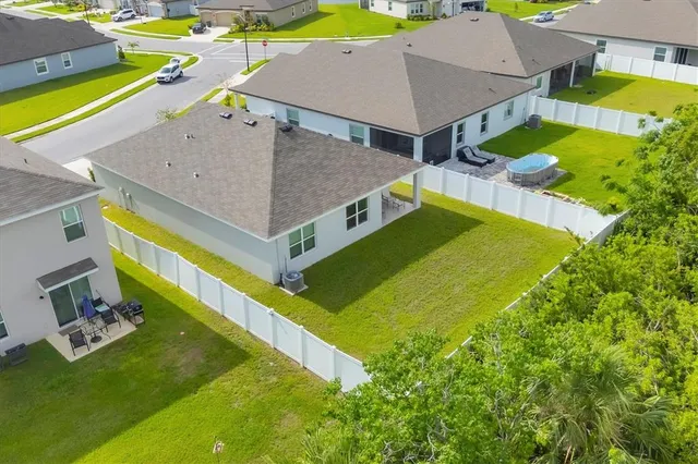 an aerial view of a house with swimming pool