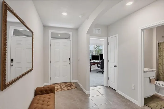 a bedroom with a bed and a bathroom