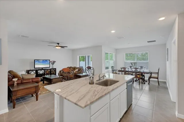 a living room with lots of furniture and a window