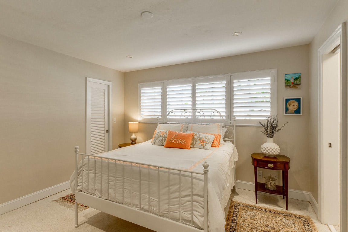 601 Southwest 1st Street Boca Raton, FL 33486 - Photo 19 of 32 a bedroom with a bed and a table in it