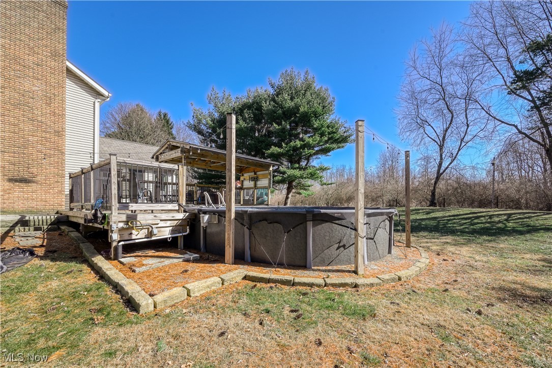 2061 Portage Line Road Mogadore, OH 44260 - Photo 46 of 48 View of yard with a wooden deck