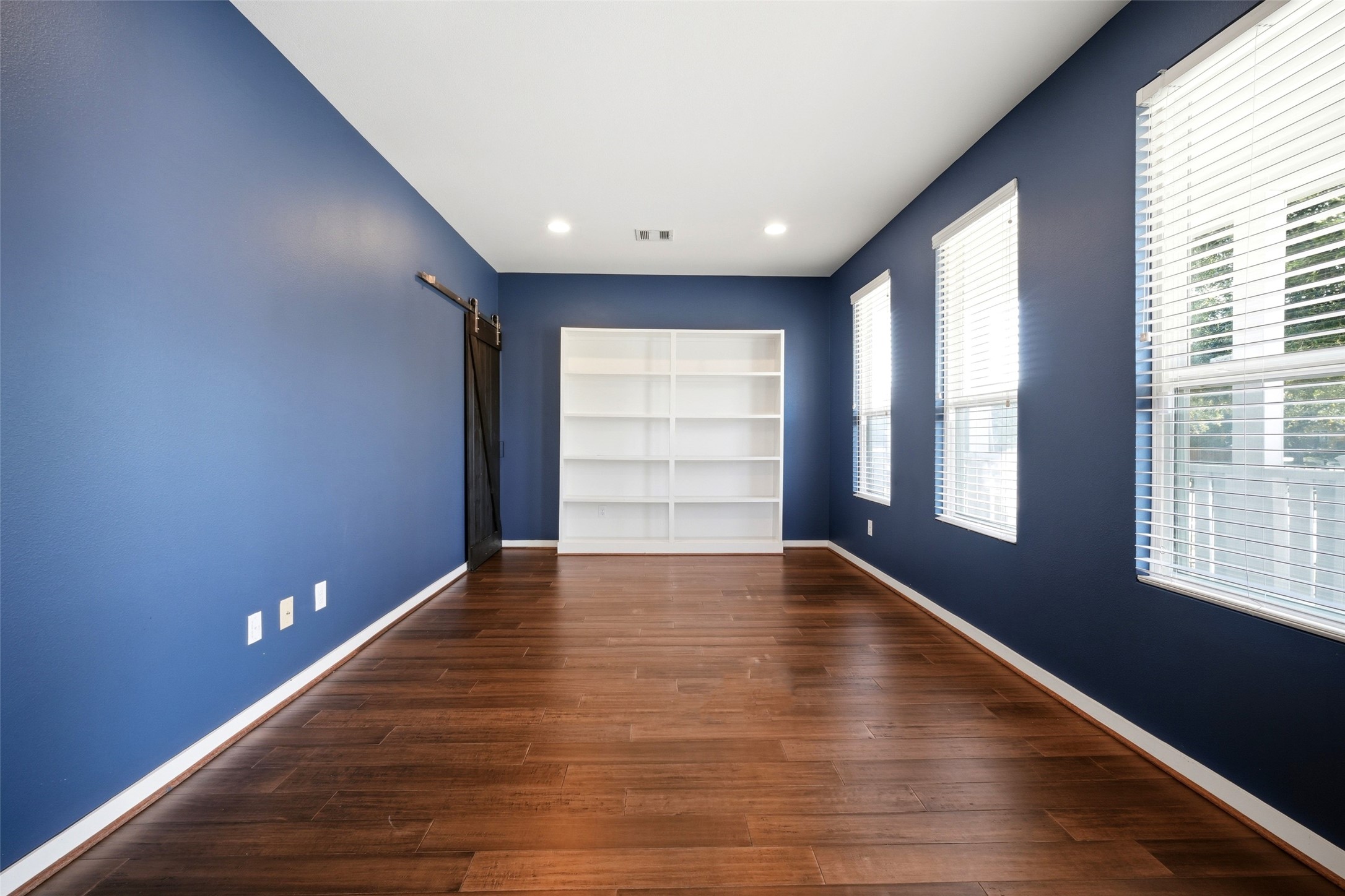605 Dumble Street Houston, TX 77023 - Photo 31 of 44 a view of empty room with wooden floor and fan