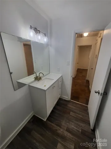 a bathroom with a double vanity sink and mirror