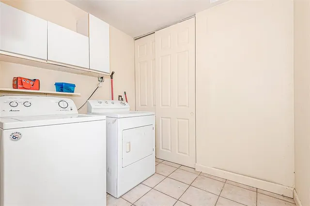 a view of a backyard with wooden fence