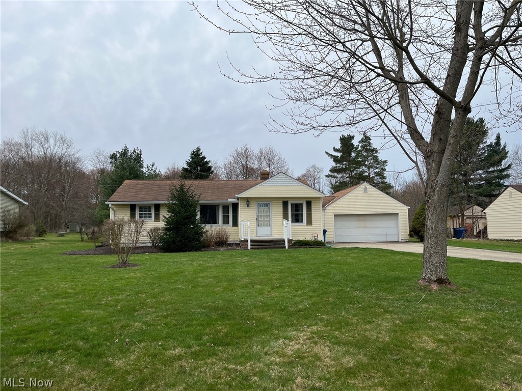 38522 Rogers Road Willoughby, OH 44094 - Photo 1 of 9 Ranch-style house featuring a front yard, a garage, and an outdoor structure