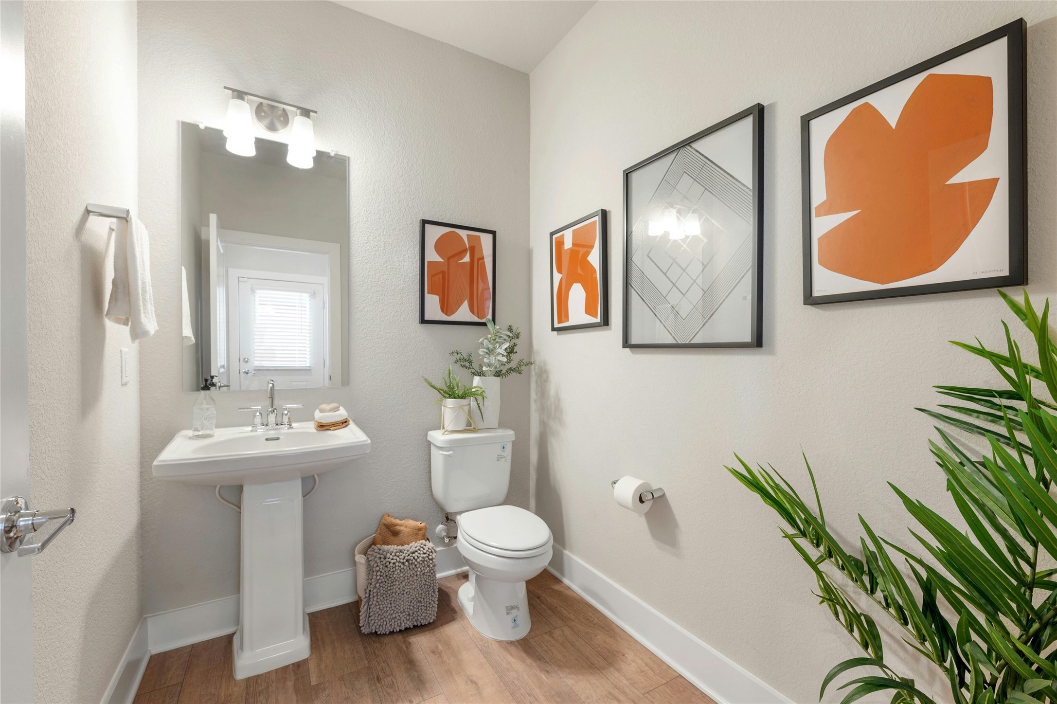 5804 Rotunda View Austin, TX 78747 - Photo 23 of 27 Wood flooring and modern fixtures create a refreshing powder room.