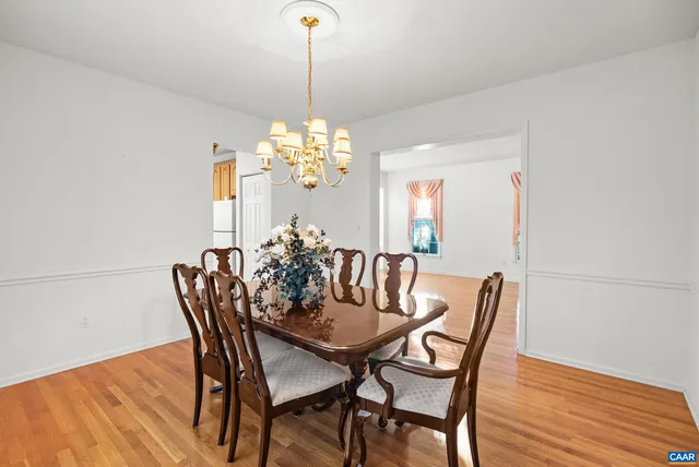 a kitchen with stainless steel appliances granite countertop a sink and wooden cabinets