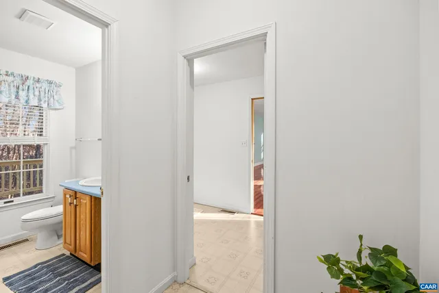 a white bath tub sitting next to a window