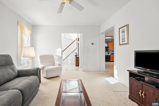 a kitchen with stainless steel appliances granite countertop a sink a stove and a granite counter tops with wooden floors