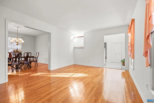 a view of a house with backyard and wooden floor