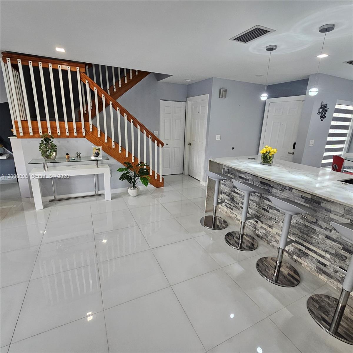 7378 Southwest 162nd Place Miami, FL 33193 - Photo 11 of 37 a view of a hallway with seating area